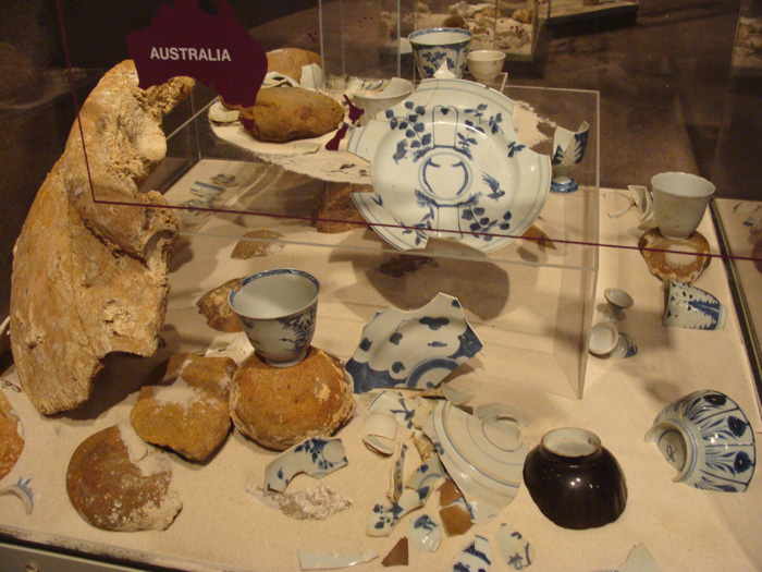 Caption 9- The blue on white porcelain dish fragments and bowls are Chinese trade goods.